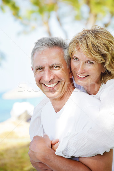 Mature couple smiling and embracing Stock photo © hannamonika