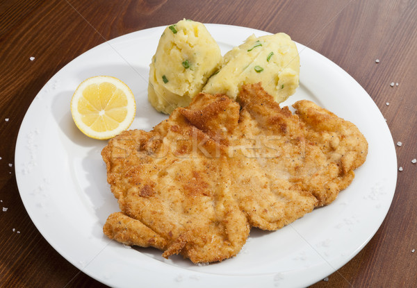 Vienna schnitzel with mashed potatoes and baby onion Stock photo © hanusst