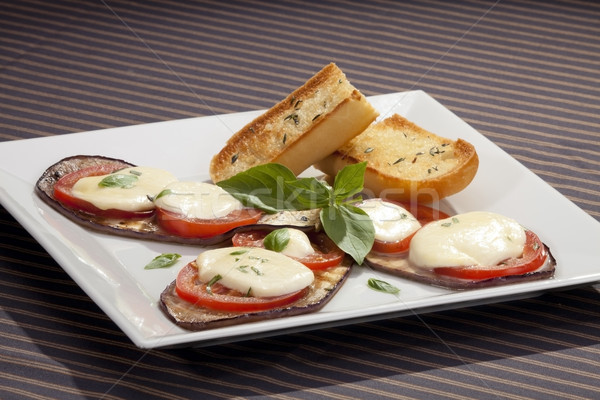 Gebakken aubergine tomaten mozzarella voedsel tabel Stockfoto © hanusst