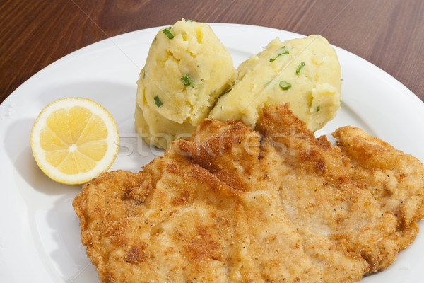 Vienna schnitzel with mashed potatoes and baby onion Stock photo © hanusst