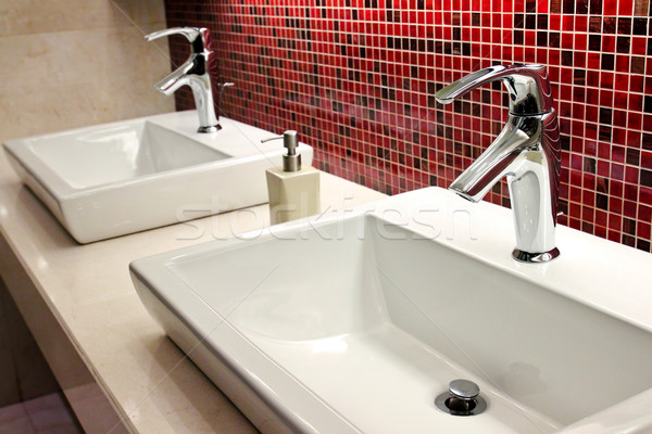 sinks and taps in a public toilet  Stock photo © happydancing