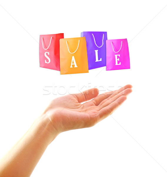 Shopping concept : Woman hand with shopping bag on sale Stock photo © happydancing
