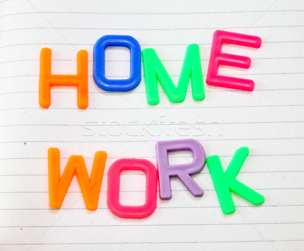 Homework in colorful toy letters on lined paper background  Stock photo © happydancing
