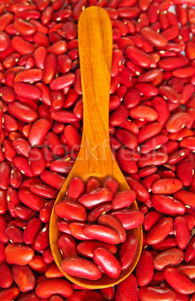Red beans over wooden spoon  Stock photo © happydancing