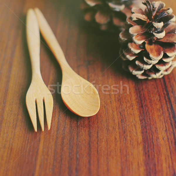Wooden spoon and fork with pine cone, retro filter effect Stock photo © happydancing