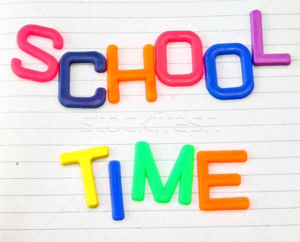 School time in colorful toy letters on lined paper background  Stock photo © happydancing