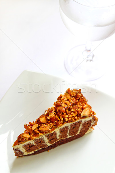 Praline cake with glass of water Stock photo © happydancing