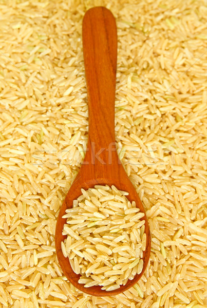 brown rice over the wooden spoon  Stock photo © happydancing