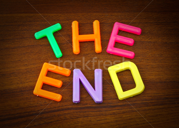Stock photo: The end in colorful toy letters on wood background