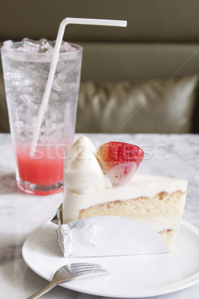 Piece of strawberry cake on white plate with cool drink in the c Stock photo © happydancing