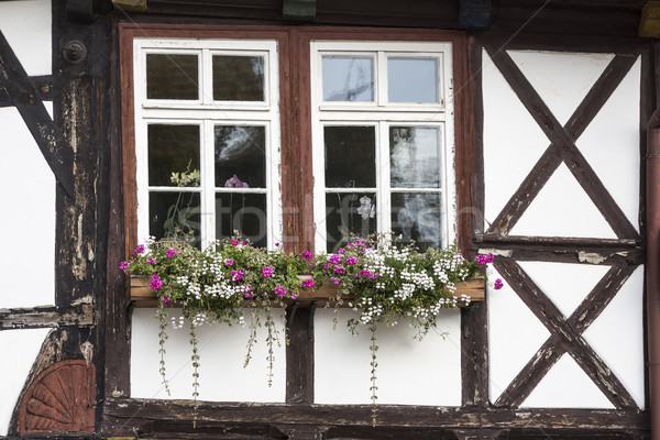 Window with flowers on a half-timbered house, Germany Stock photo © haraldmuc