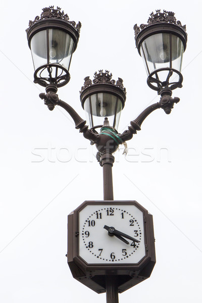 Metallic retro lamppost with clock in Paris, France Stock photo © haraldmuc