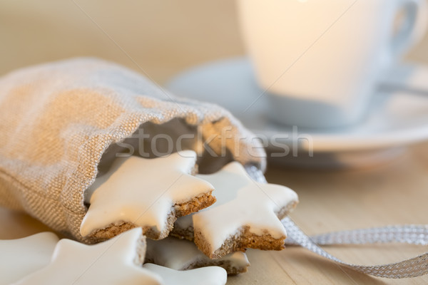 Cinnamon stars falling out a small bag Stock photo © haraldmuc