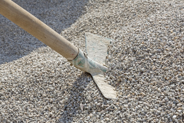 Shovel in a heap of grit Stock photo © haraldmuc