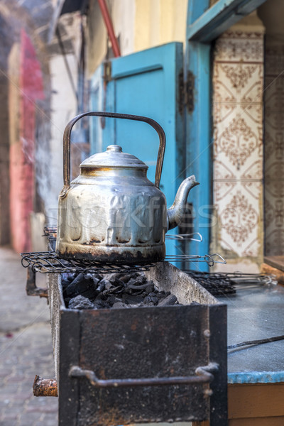 Single silver tea pot in a Moroccan alley Stock photo © haraldmuc