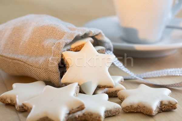 Cinnamon stars falling out a small bag Stock photo © haraldmuc