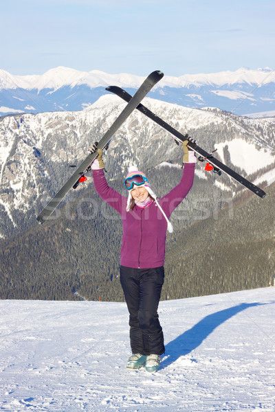 Girl with skis in mountains Stock photo © Harlekino