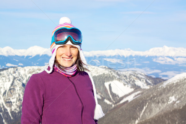 Smiling girl in snowy mountains Stock photo © Harlekino