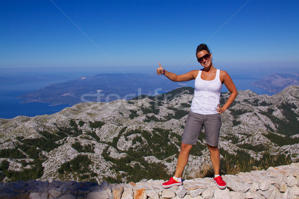 Smiling girl on hilltop Stock photo © Harlekino