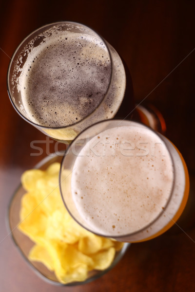 Vidrio cerveza beber primer plano patatas Foto stock © hiddenhallow