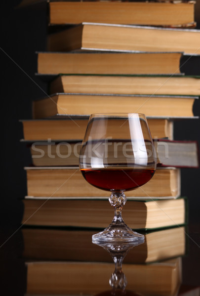 Glass of brandy and books Stock photo © hiddenhallow