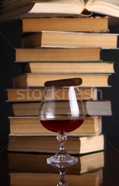 Glass of brandy and books Stock photo © hiddenhallow