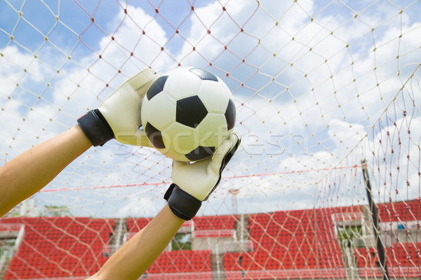 Goalkeeper used hands for catches the ball Stock photo © hin255