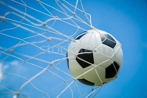 Soccer ball in the goal after shooted  Stock photo © hin255