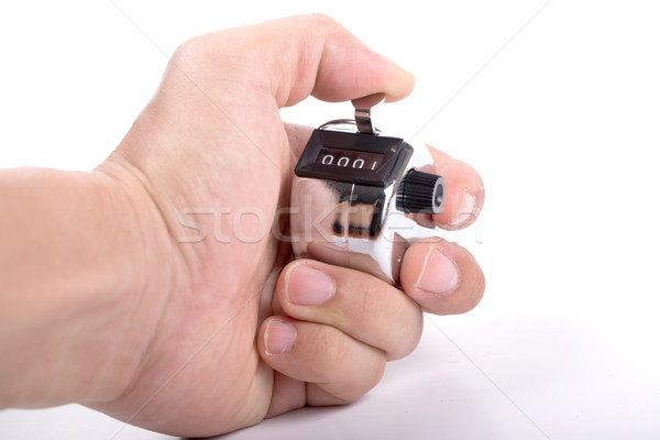 Hand holding Silver pedometer pressing Stock photo © hin255