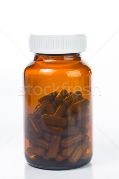 Pílulas droga recipiente isolado branco fundo Foto stock © hin255