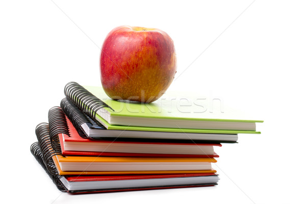 Apple on top colorful books isolated  Stock photo © hin255