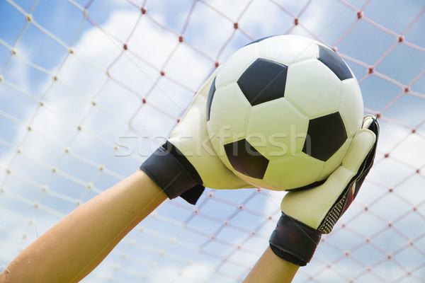 Goalkeeper used hands for catches the ball Stock photo © hin255