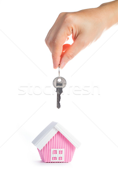 Real estate concept with hand holding key. Stock photo © hin255
