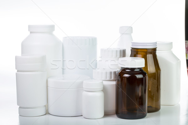 Stock photo: Pills and drug container