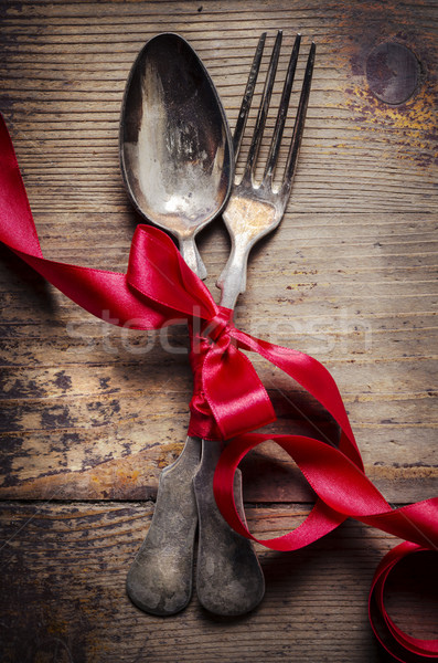 Klasszikus ezüst étkészlet díszített vörös szalag étel háttér Stock fotó © hitdelight
