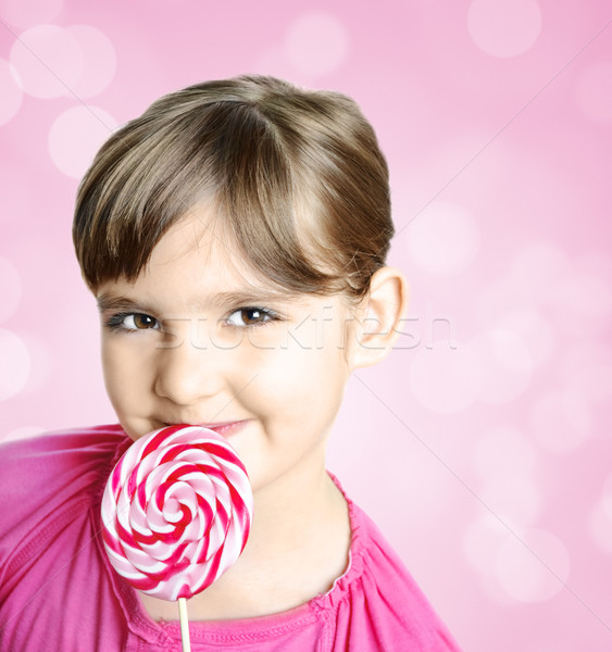 Ragazza lollipop bella bambina alimentare faccia Foto d'archivio © hitdelight