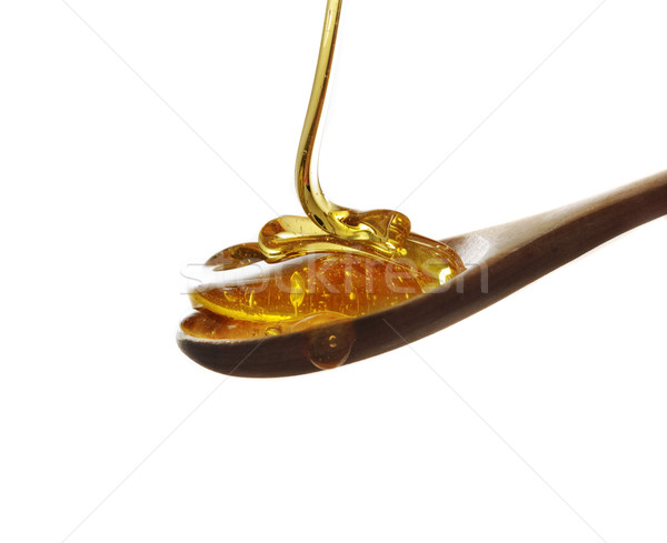 Spoon of honey Stock photo © hitdelight