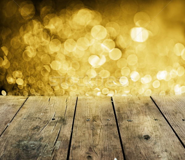 Wooden table with golden lights Stock photo © hitdelight
