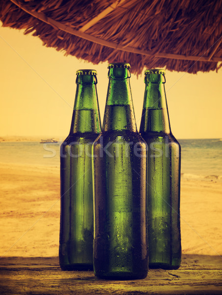 Foto stock: Cerveja · garrafas · praia · retro · filtrar · céu
