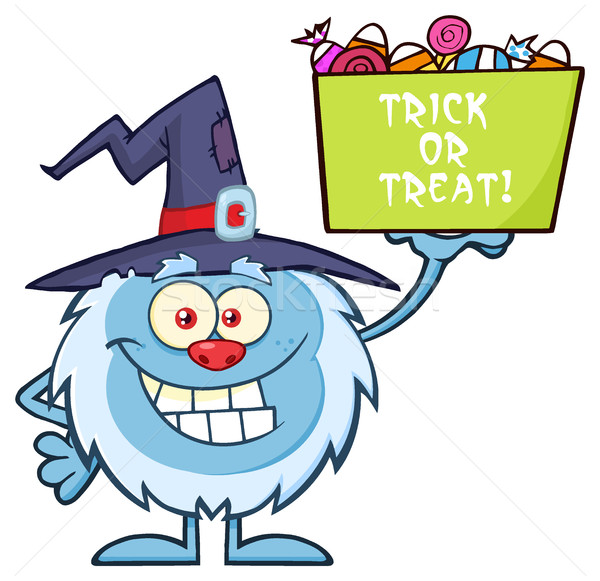 Cute Little Yeti Cartoon Mascot Character With Witch Hat Holding Up A Trick Or Treat Halloween Candy Stock photo © hittoon