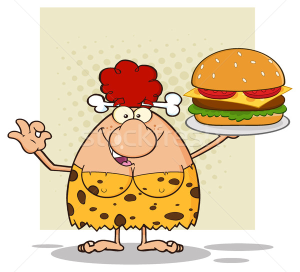 Smiling Red Hair Cave Woman Cartoon Mascot Character Holding A Big Burger And Gesturing Ok Stock photo © hittoon