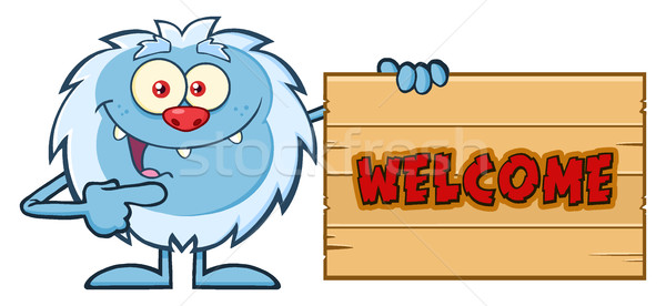 Cute Little Yeti Cartoon Mascot Character Pointing To A Welcome Wooden Sign Stock photo © hittoon