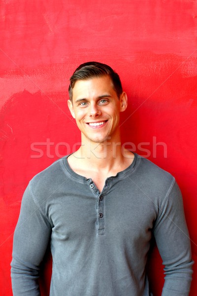 Portrait homme permanent rouge mur visage [[stock_photo]] © hlehnerer