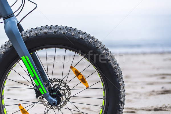 Gordura bicicleta praia céu esportes mar Foto stock © Hochwander