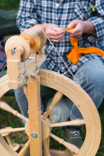 woman working with spinning wheel Stock photo © Hochwander