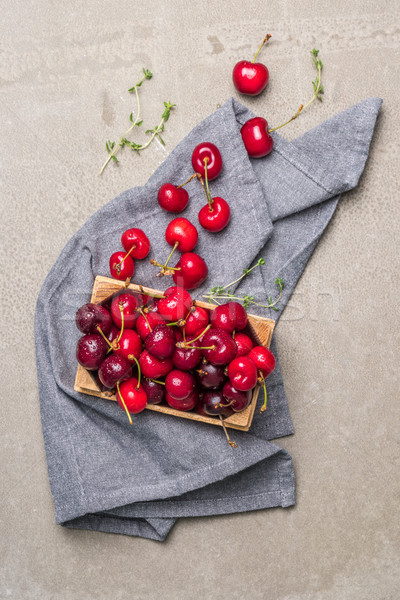 Red ripe cherries in small wooden box Stock photo © homydesign