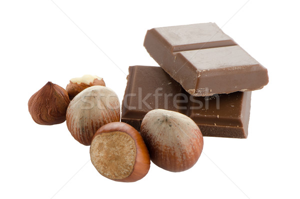 Csokoládé szelet mogyoró fehér levél háttér fekete Stock fotó © homydesign