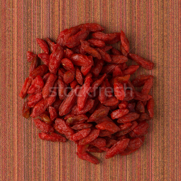 Circle of dry red goji berries Stock photo © homydesign