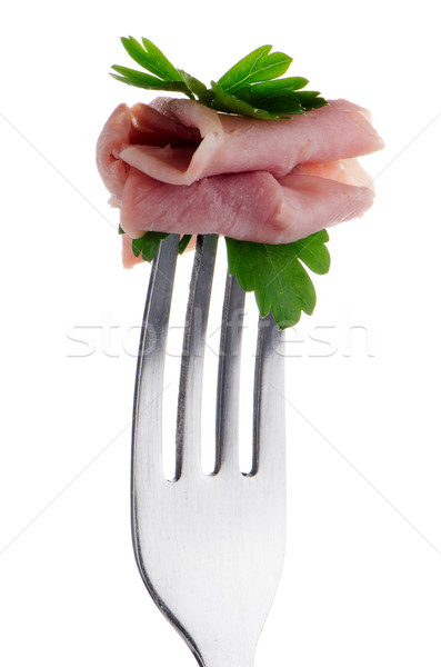 Stock photo: Slice of ham skewered on a fork 