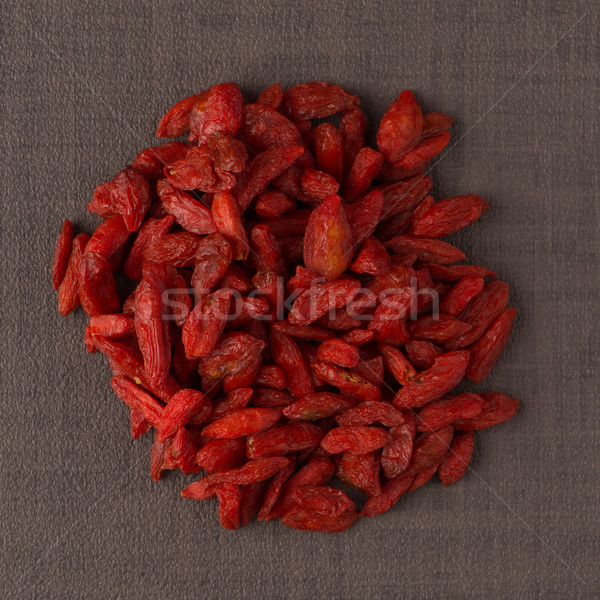 Stock photo: Circle of dry red goji berries
